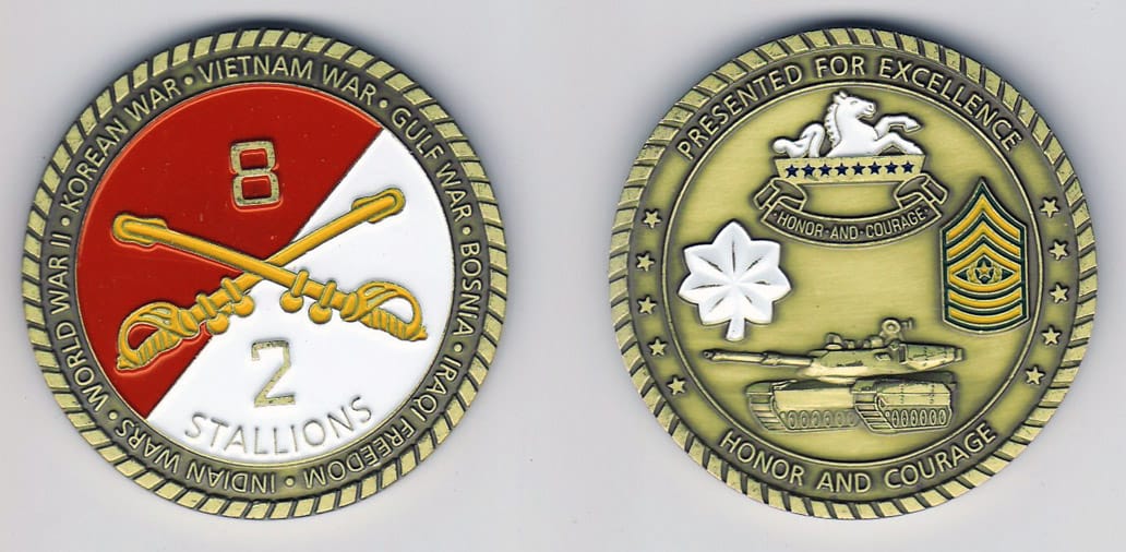 Round shaped, brass colored coin, 2 inches in diameter.