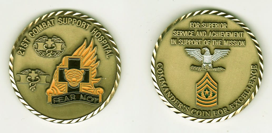 Round shaped, brass colored coin, 2 inches in diameter.