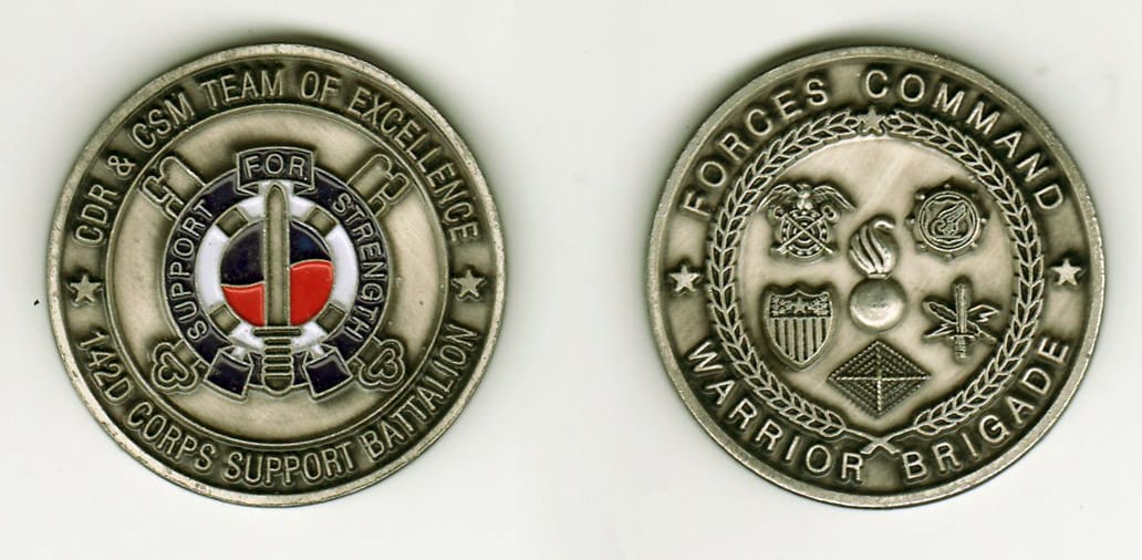 Round shaped, pewter colored coin, 1-5/8 inches in diameter.