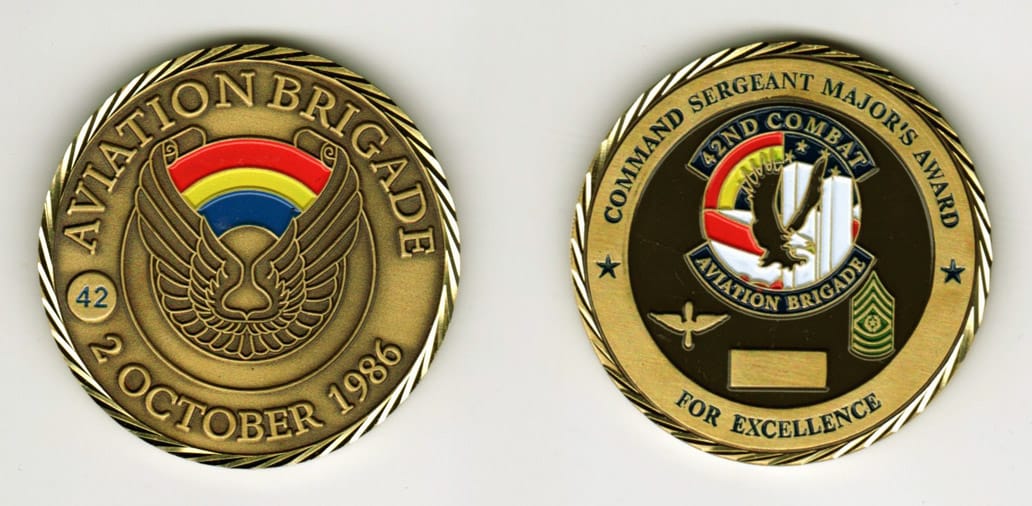 Round shaped, brass colored coin, 1-15/16 inches in diameter.