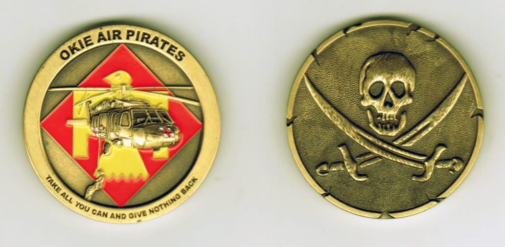 Round shaped, brass colored coin, 1-11/16 inches in diameter.