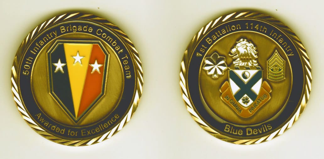 Round shaped, brass colored coin, 1-11/16 inches in diameter.