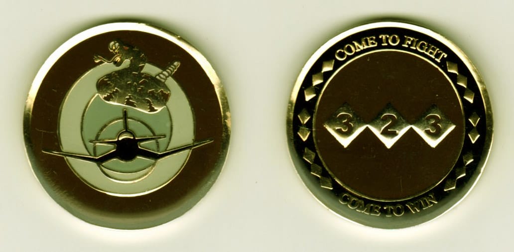 Round shaped, gold colored coin, 1-3/8 inches in diameter.