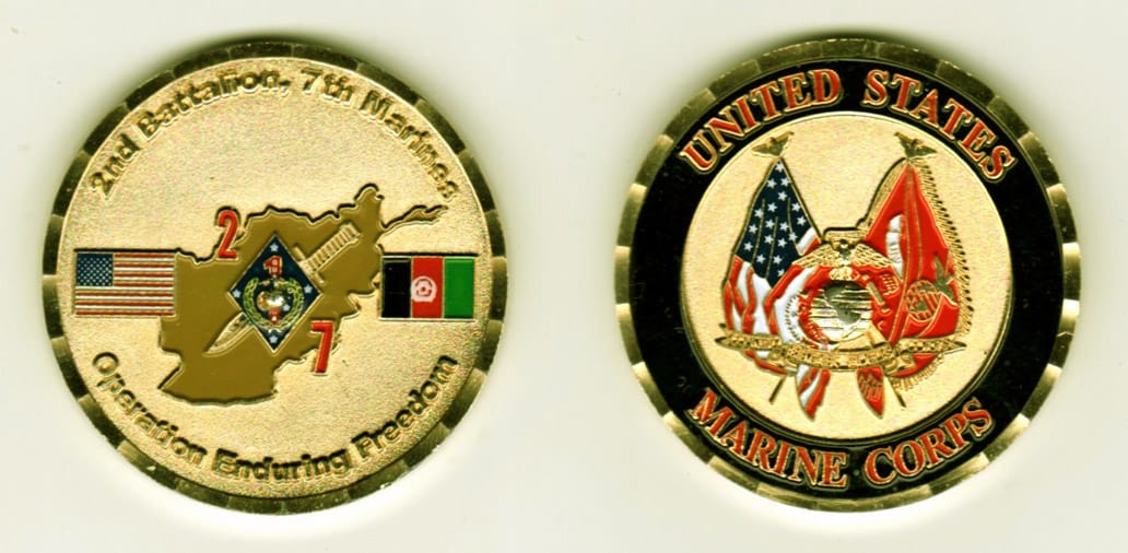 Round shaped, gold colored coin, 1-13/16 inches in diameter.