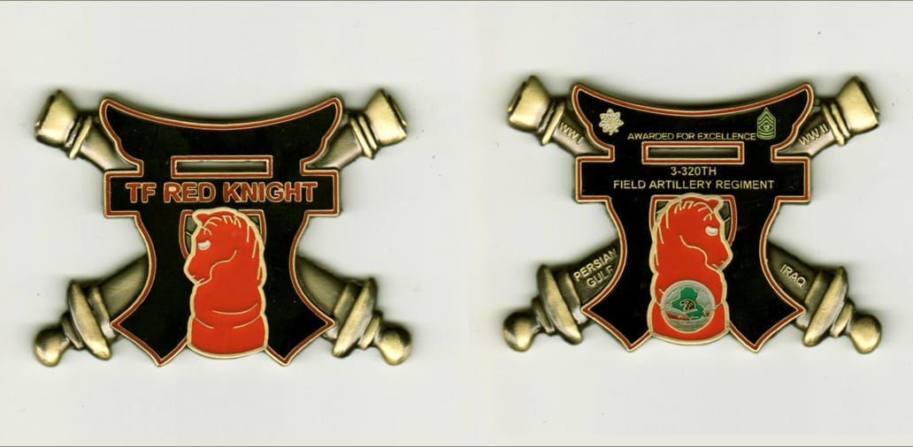 Crossed Cannon  shaped, antique brass colored coin, 2-1/2 inches wide and 1- 11/16 inches high.