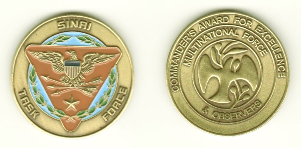 Round shaped, antique brass colored coin, 1-1/4 inches in diameter.