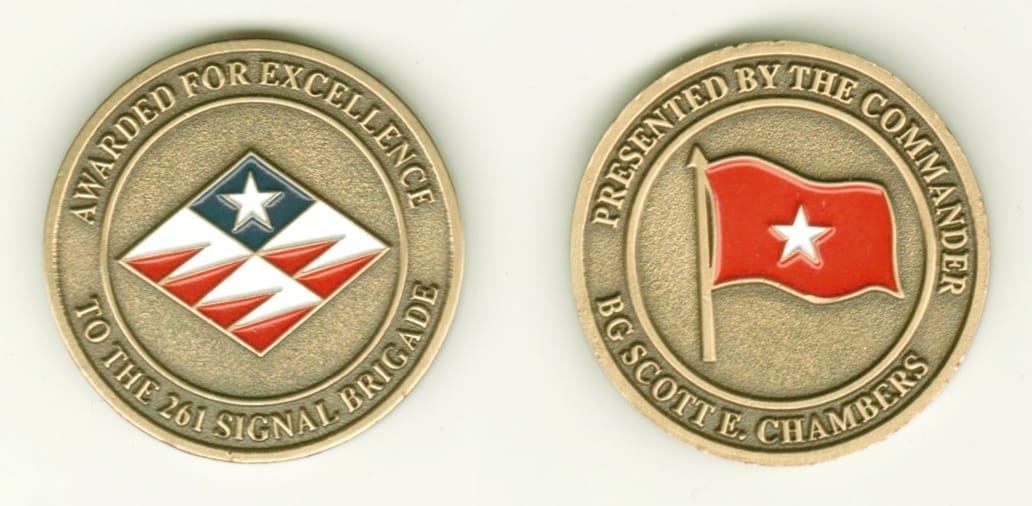 Round shaped, antique brass colored coin, 1-3/8 inches in diameter.