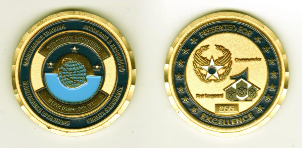 Round shaped, gold colored coin, 1-5/8 inches in diameter.