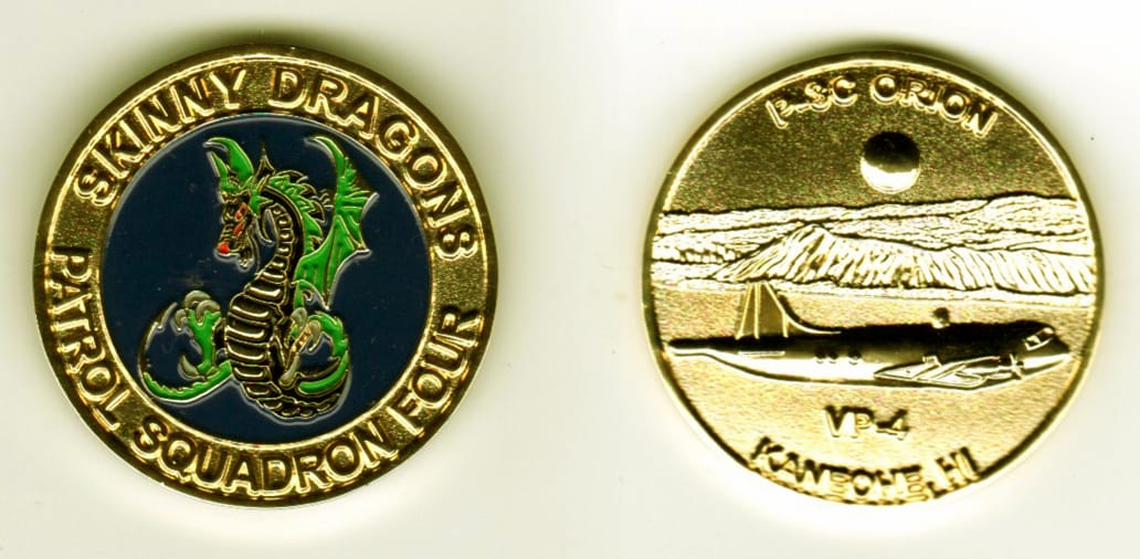 Round shaped, gold colored coin, 1-1/4 inches in diameter.