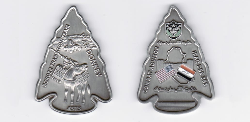 Arrowhead shaped, pewter colored coin, 2- 1/4 inches high by 1 1/2 wide.