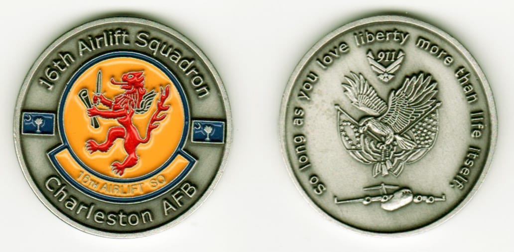 Round shaped, pewter colored coin, 1-1/4 inches in diameter.