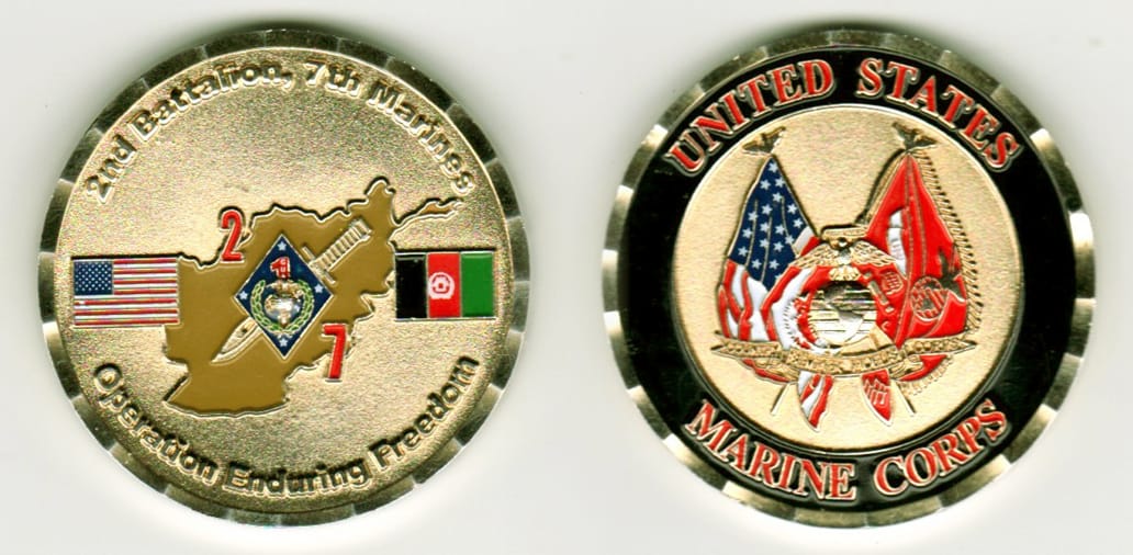 Round shaped, gold colored coin, 1-13/16 inches in diameter.