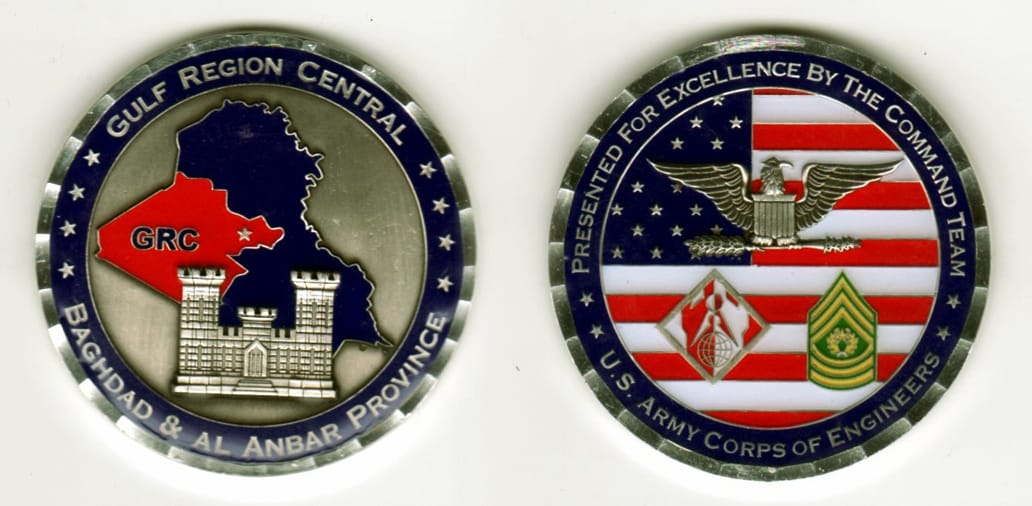 Round shaped, silver colored coin, 2-1/8 inches in diameter.