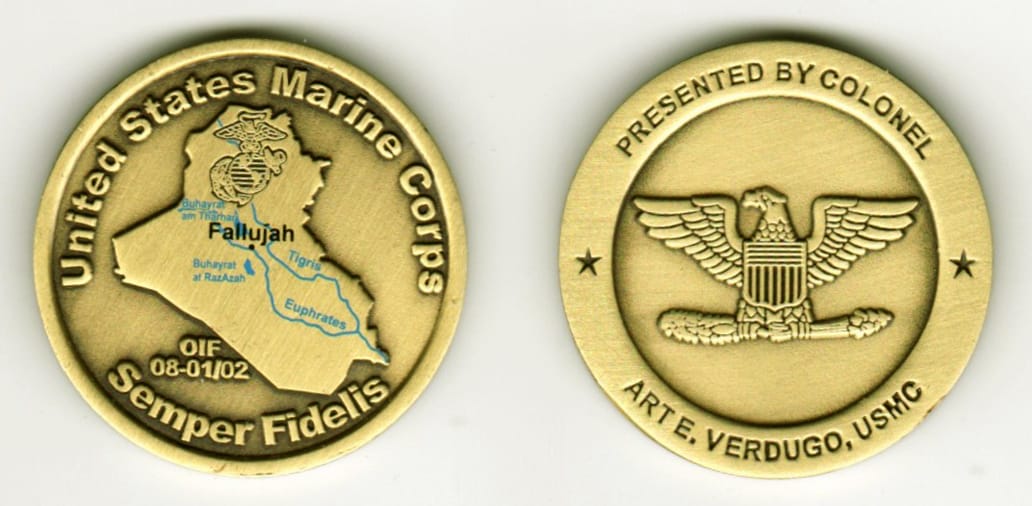 Round shaped, brass colored coin, 1-1/4 inches in diameter.