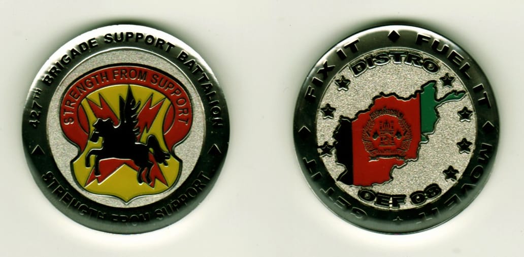 Round shaped, silver colored coin, 1-1/4 inches in diameter.