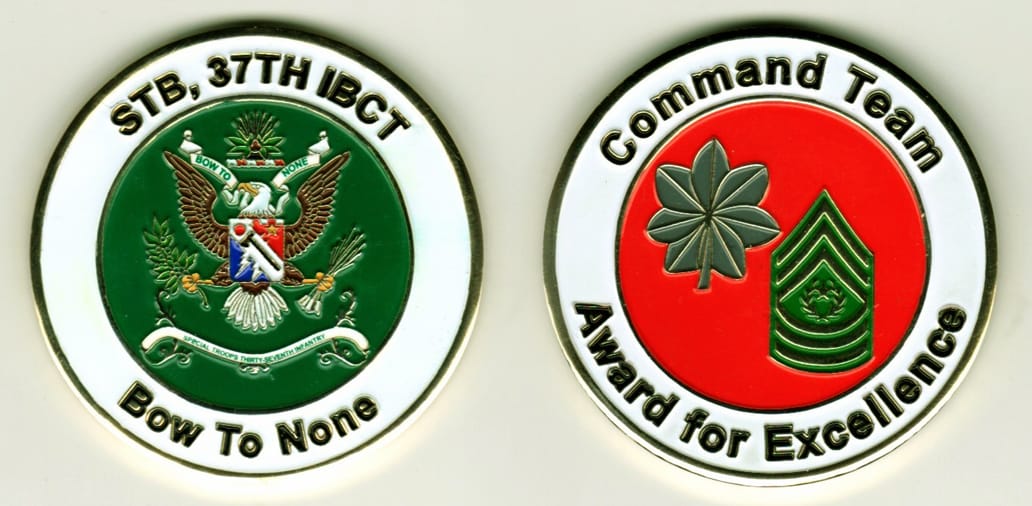 Round shaped, gold colored coin, 2-1/8 inches in diameter.