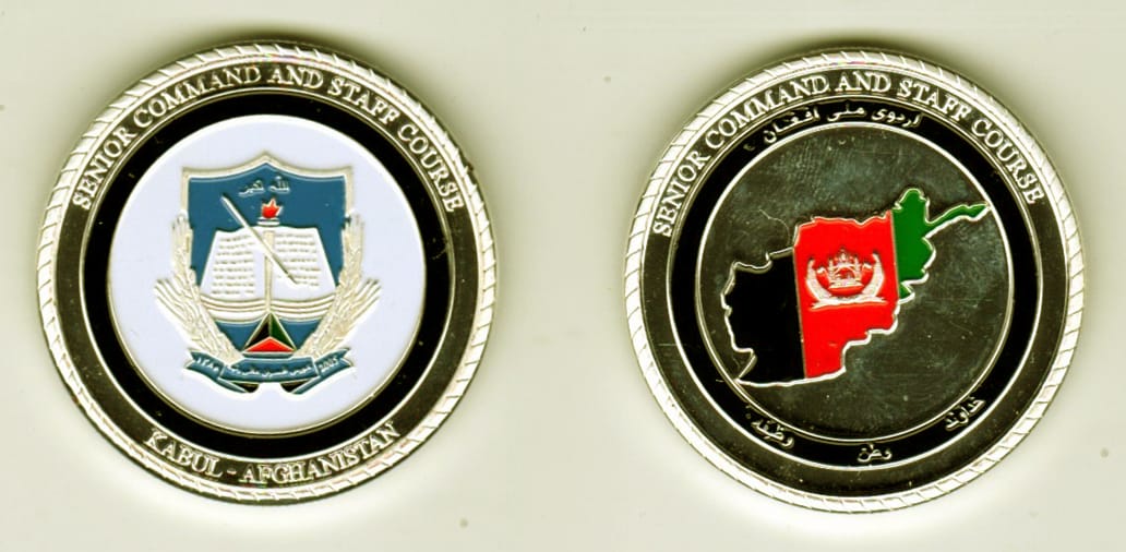 Round shaped, silver colored coin, 1- 9/16 inches in diameter.