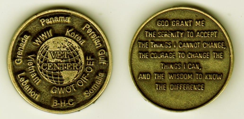 Round shaped, antique brass colored coin, 1-1/8 inches in diameter.