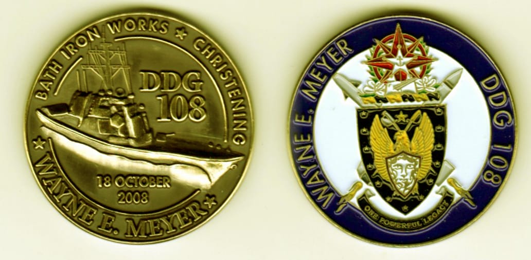 Round shaped,  brass colored coin, 1 1/4 inches in diameter.