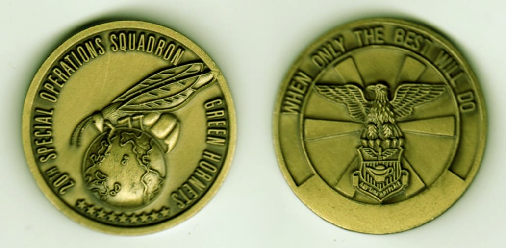 Round shaped, brass colored coin, 1-5/8 inches in diameter.