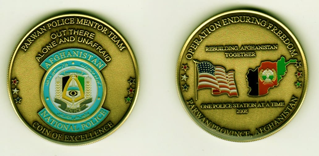 Round shaped, brass colored coin, 1 13/16 inches in diameter.