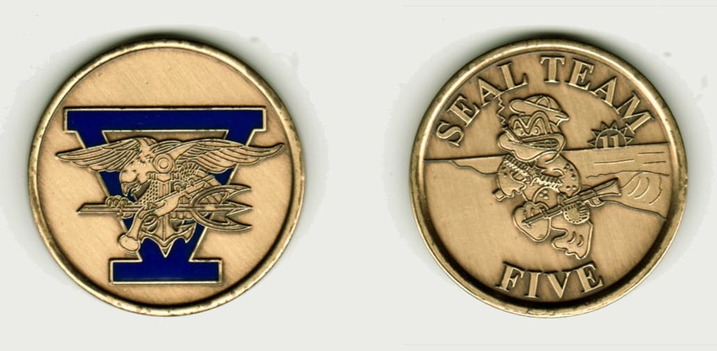 Round shaped, brass colored coin, 1 1/4 inches in diameter.