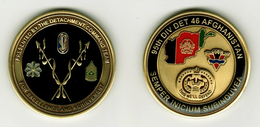 Round shaped, brass colored coin, 1 13/16 inches in diameter.