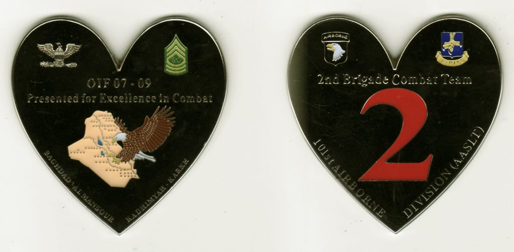 Heart shaped, sliver colored coin, 2 1/2 inches wide x 2 1/2 inches high.