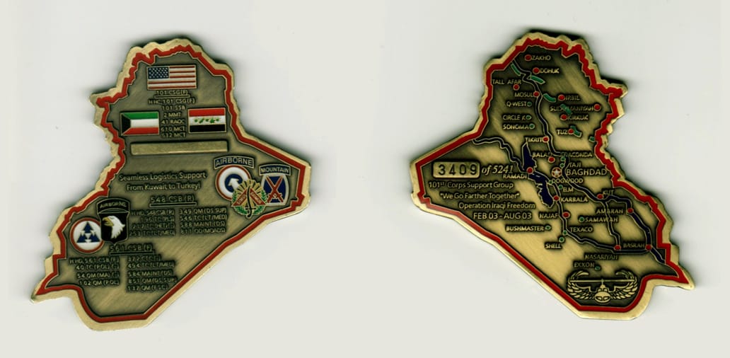 Iraq shaped, brass colored coin, 2 inches wide x 2 1/2 inches high.