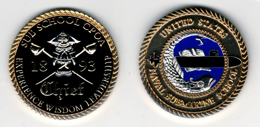 Round shaped, gold colored coin, 1 13/16 inches in diameter.