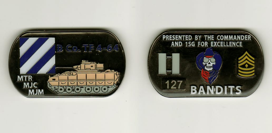 Dog tag shaped, black colored coin, 2 1/4 inches wide x 1 1/4 inches high.