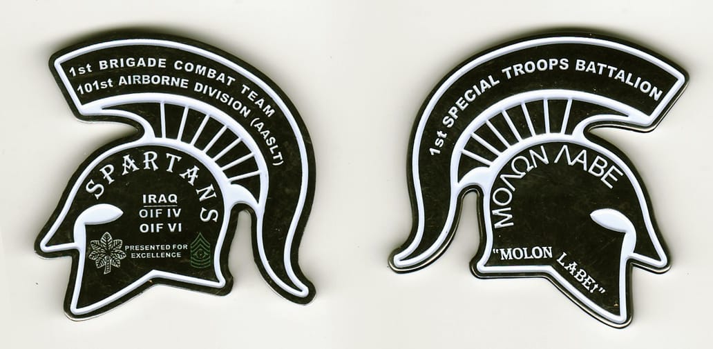 Roman helmet  shaped, silver colored coin 2  inches wide x 1 -5/8  inches high.