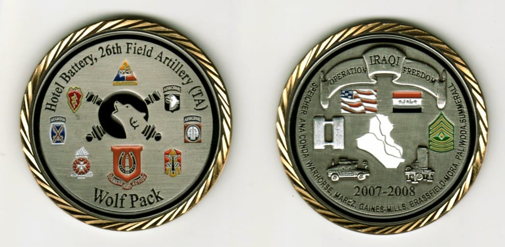 Round shaped, pewter colored coin with gold colored rim, 2 1/8  inches in diameter.