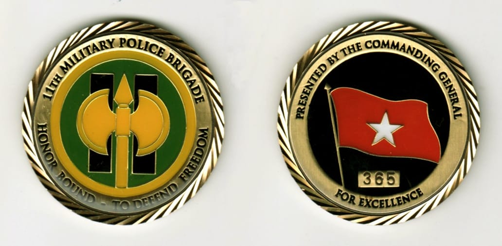 Round shaped, gold colored coin, 1 11/16  inches in diameter.