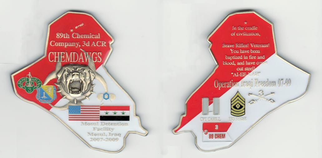 Iraqi shaped, brass colored coin, 2 1/4 inches wide x 3  inches high.