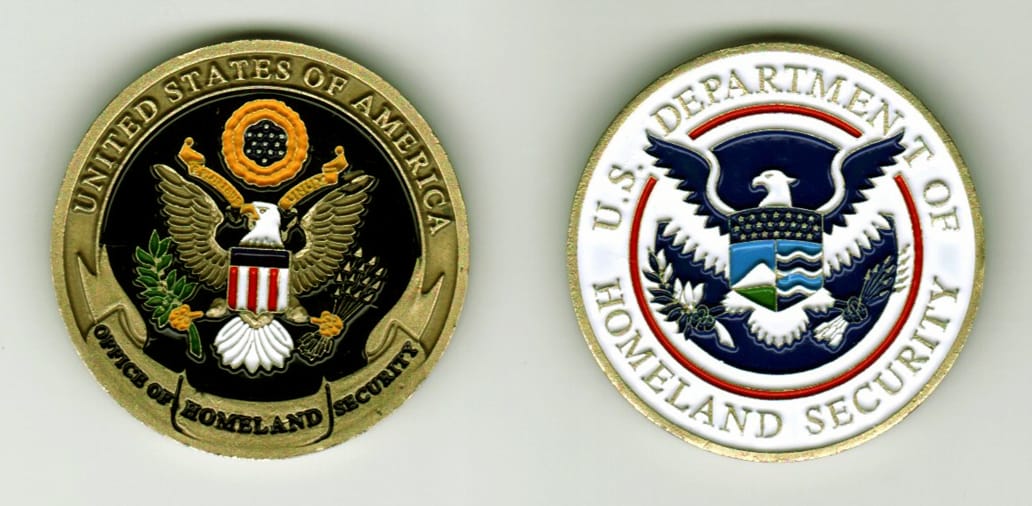 Round shaped, brass colored coin, 1 1/2  inches in diameter.