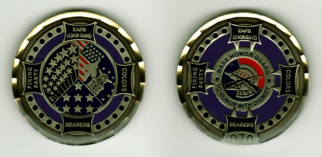 Round shaped, pewter colored coin, 1 1/4  inches in diameter.