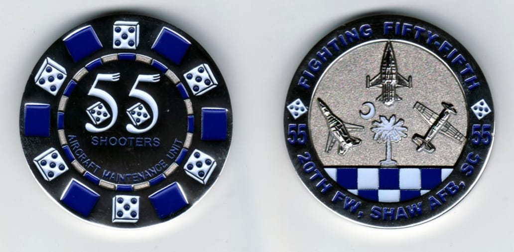 Round shaped, silver colored coin, 1 13/16  inches in diameter.