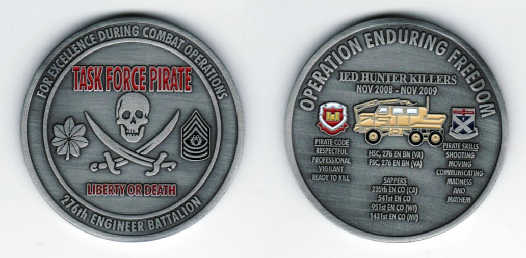 Round shaped, pewter colored coin, 2 1/8  inches in diameter.