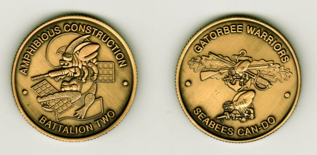 Round shaped, brass colored coin, 1 1/4  inches in diameter.