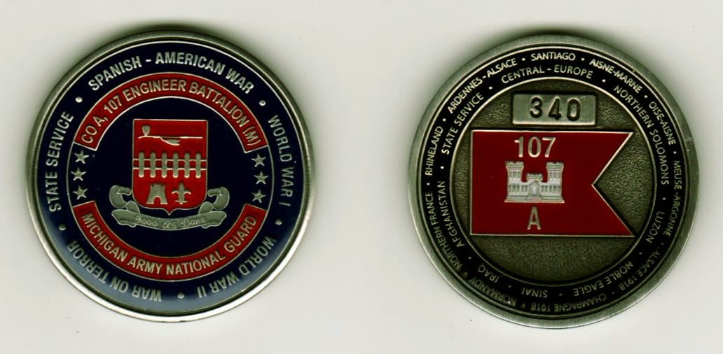 Round shaped, pewter colored coin, 1 1/4  inches in diameter.