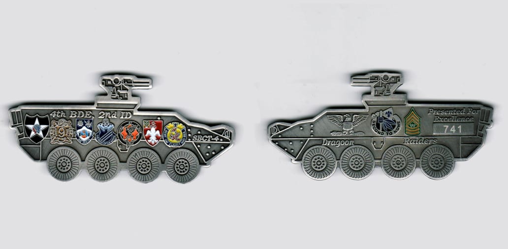 Armored vehicle shaped, silver colored coin, 3 1/2 inches wide by 1 1/2  inches high.