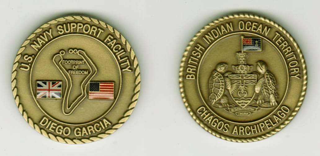 Round shaped, antique brass colored coin, 1 9/16 inches in diameter.