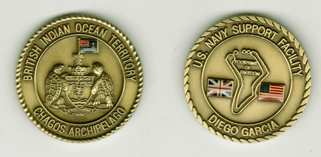 Round shaped, antique brass colored coin, 1 9/16 inches in diameter.