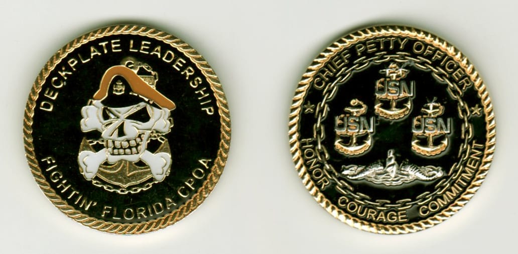 Round shaped, gold colored coin, 1 1/4 inches in diameter.