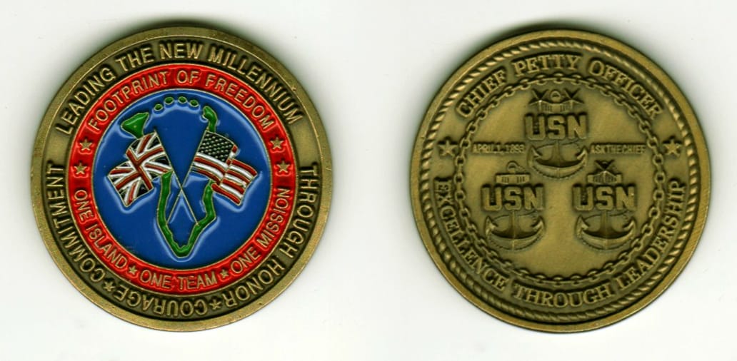 Round shaped, antique brass colored coin, 1 1/2 inches in diameter.