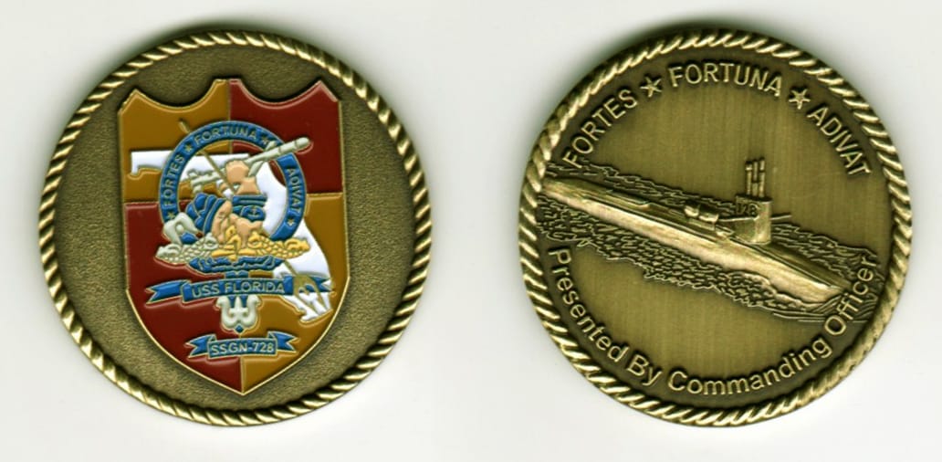 Round shaped, antique brass colored coin, 1 1/4 inches in diameter.