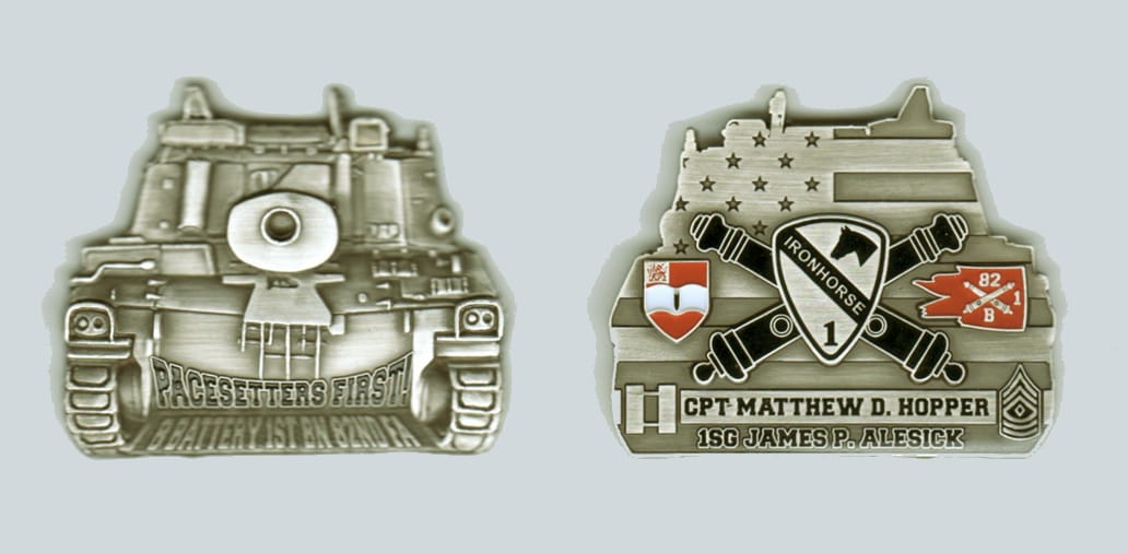 Tank shaped, silver colored coin, 2 inches wide x 1 3/4 inches high.