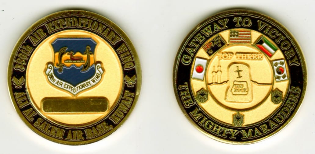 Round shaped, gold colored coin, 1 11/16 inches in diameter.