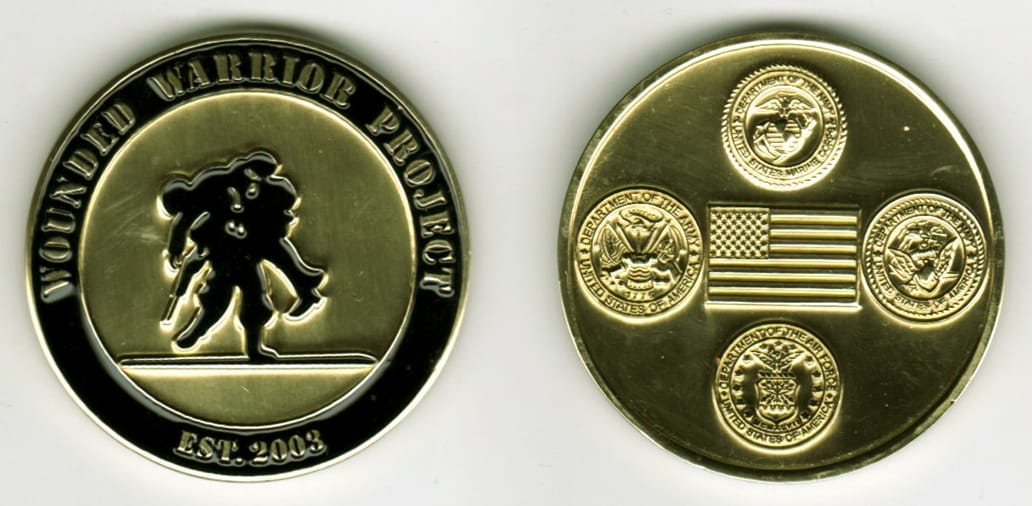 Round shaped, gold colored coin, 1 13/16 inches in diameter.